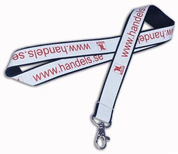 A white and black lanyard with red printed text reading 'www.handels.