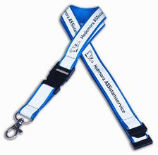 A blue and white adjustable lanyard strap with black plastic buckles and a silver metal clasp, featuring printed text that reads 'Hedemora ASSISTANTSERVICE'.