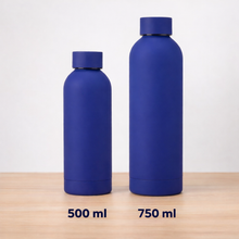 Two blue water bottles with 500 ml and 750 ml labels on a wooden surface.