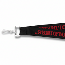 A black Custom Woven Lanyards with red text reading 'Memorial Middle School 