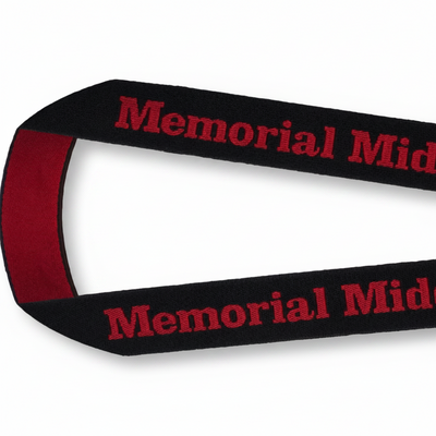 A black Custom Woven Lanyards with red text reading 'Memorial Middle School "SOLDIERS"' printed repeatedly, featuring a red inner loop and a silver metal clasp on a white background.
